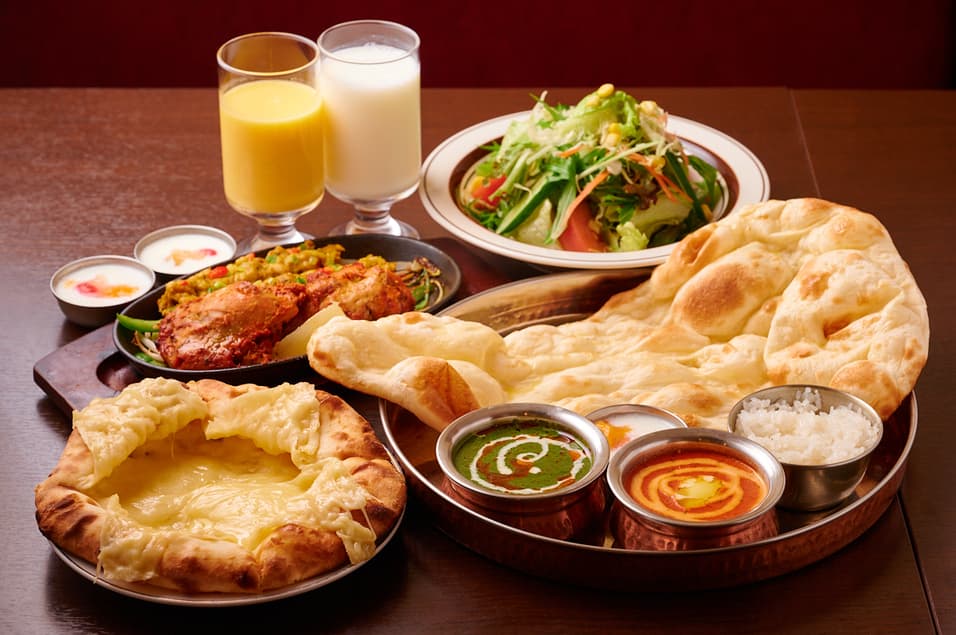 Set meal with naan, curries, grilled dishes, rice, salad and drinks at Sakura Asian Dining & Bar